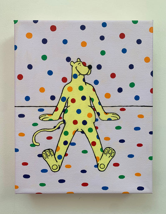 Canvas painting on a white wall of a yellow cartoon leopard character with rainbow polka dot pattern on a polka dot background sitting on the ground
