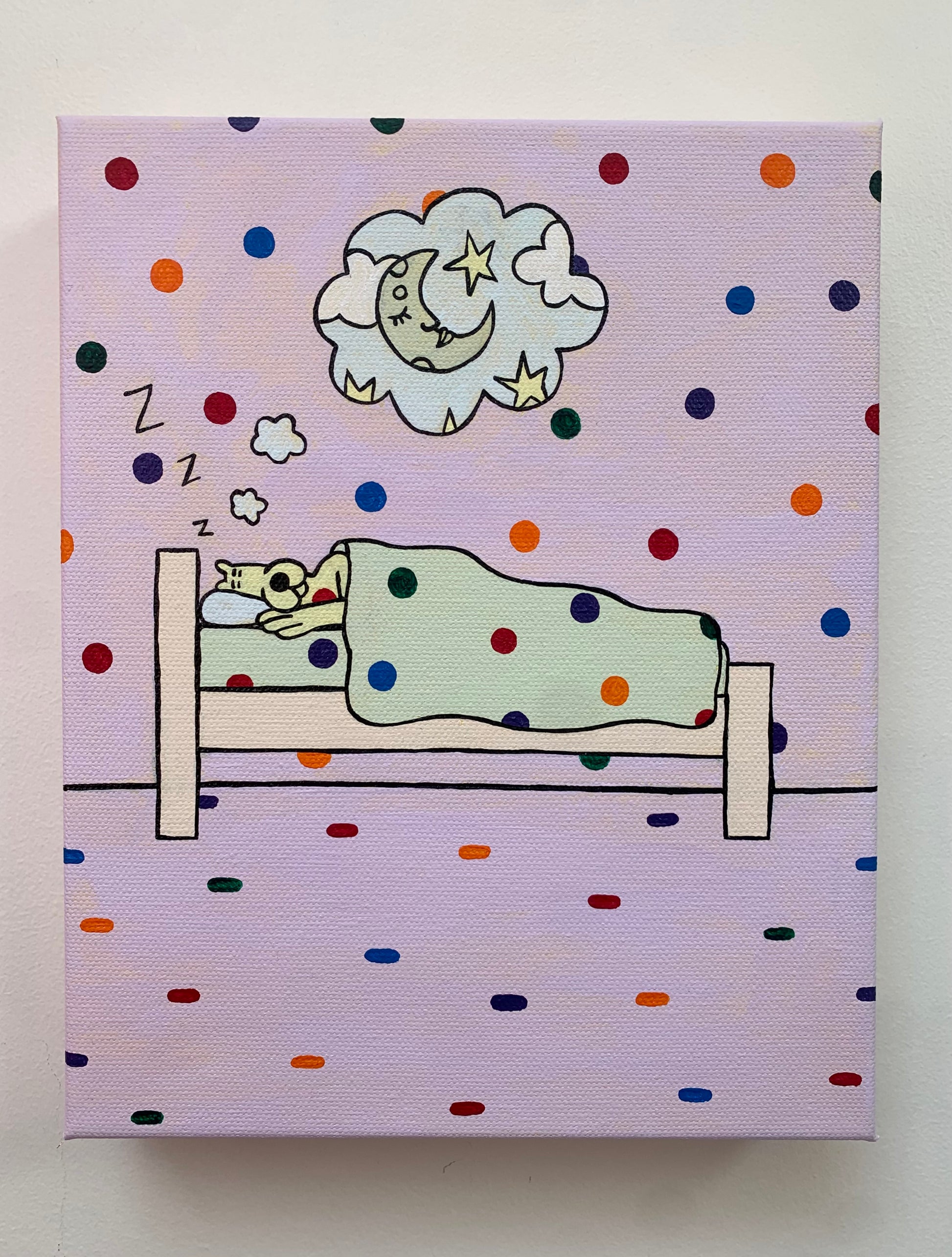 Canvas painting against a white wall of a sleeping yellow leopard under a blanket. Side view of the bed. Dream clouds with an image of a moon a stars. Rainbow spots all over the background.