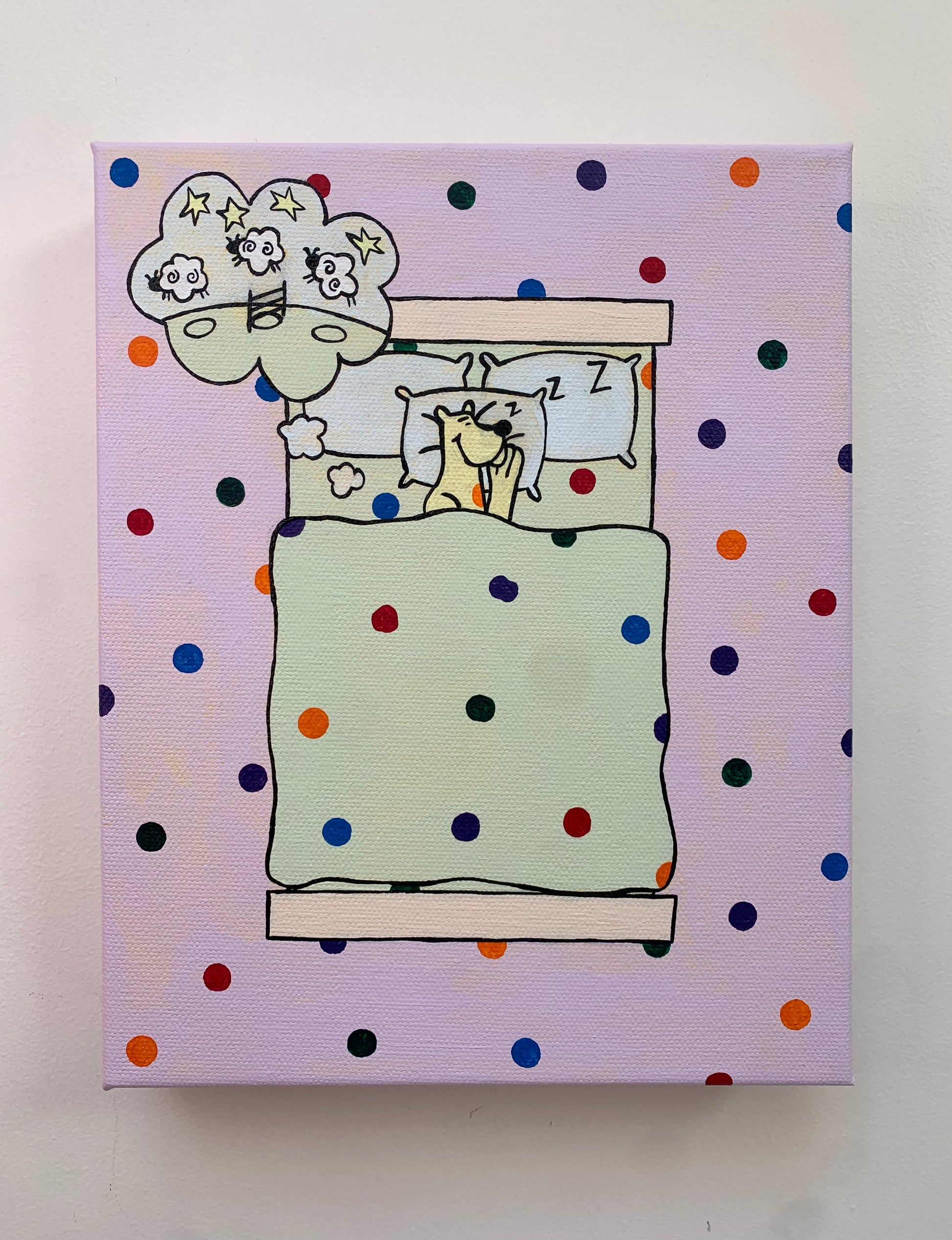 Canvas painting on a white background of a cartoon leopard sleeping in a bed. Overhead view. Dream bubble with the image of sheep jumping over a fence. Rainbow spots all over the background.