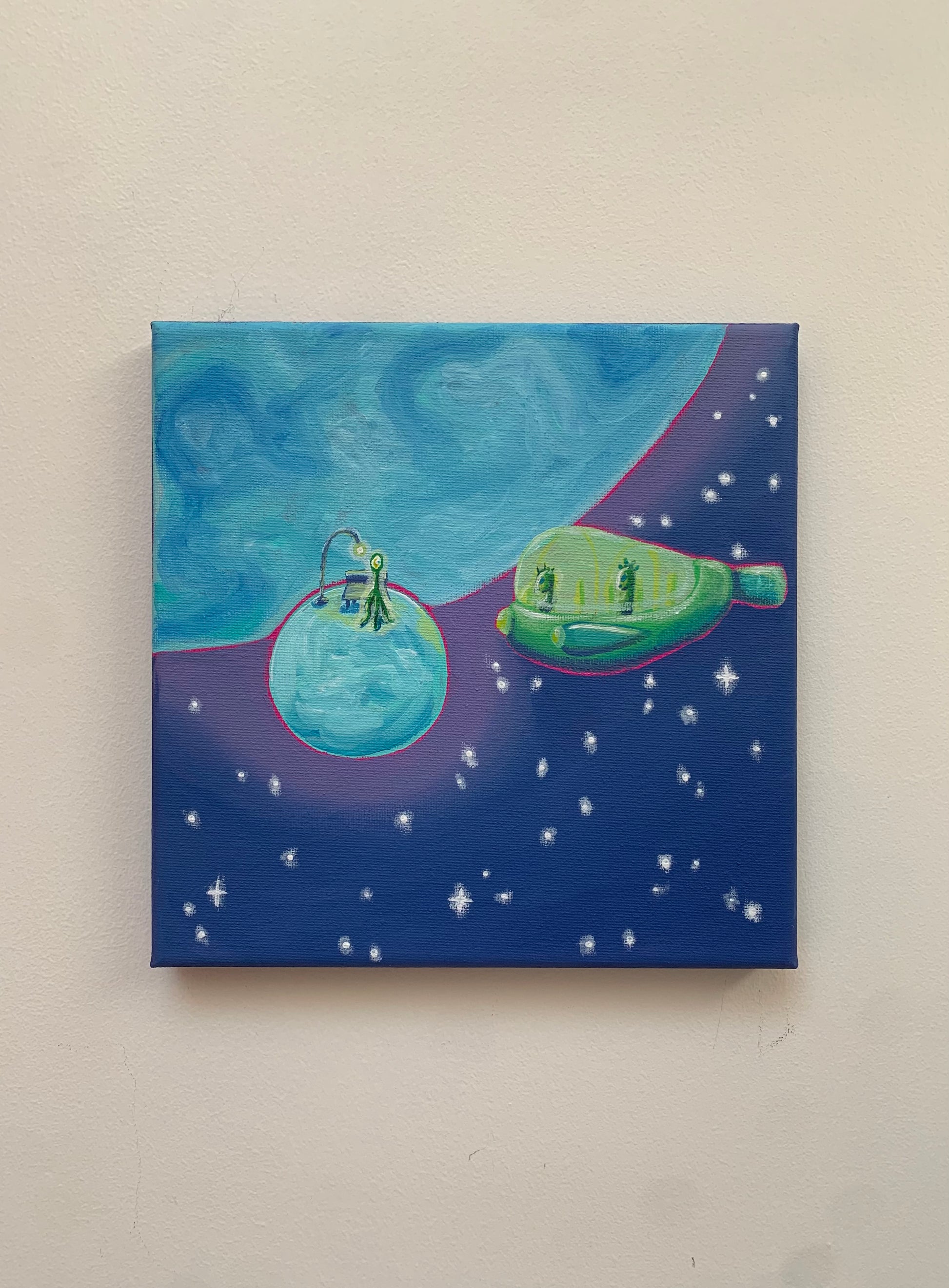Canvas painting of a ship floating in space with stars on a beige wall.
